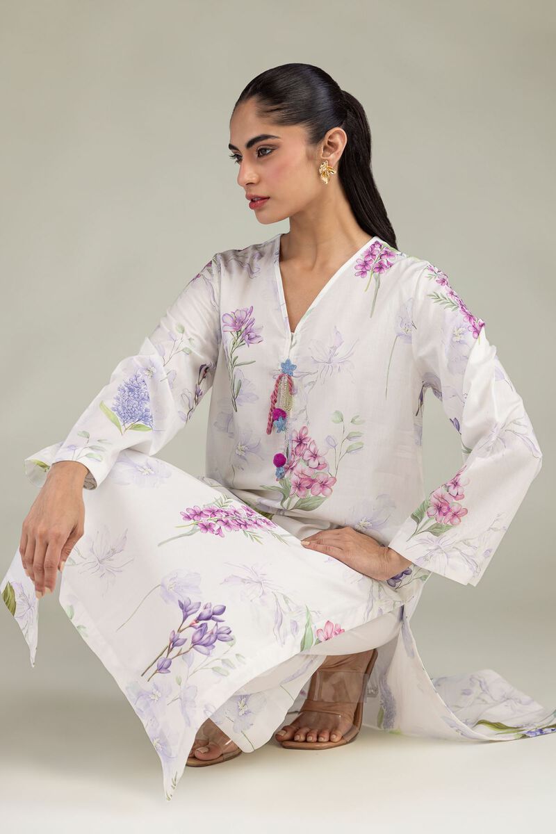 Model wearing a floral Indian kurta